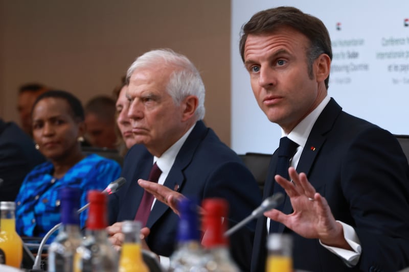 French President Emmanuel Macron, right, speaks during a session at the international conference on Sudan, Monday, April 15, 2024 in Paris. AP