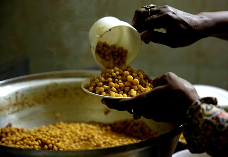 A Sudanese woman prepares an Iftar meal at home in Cairo, Egypt. Reuters