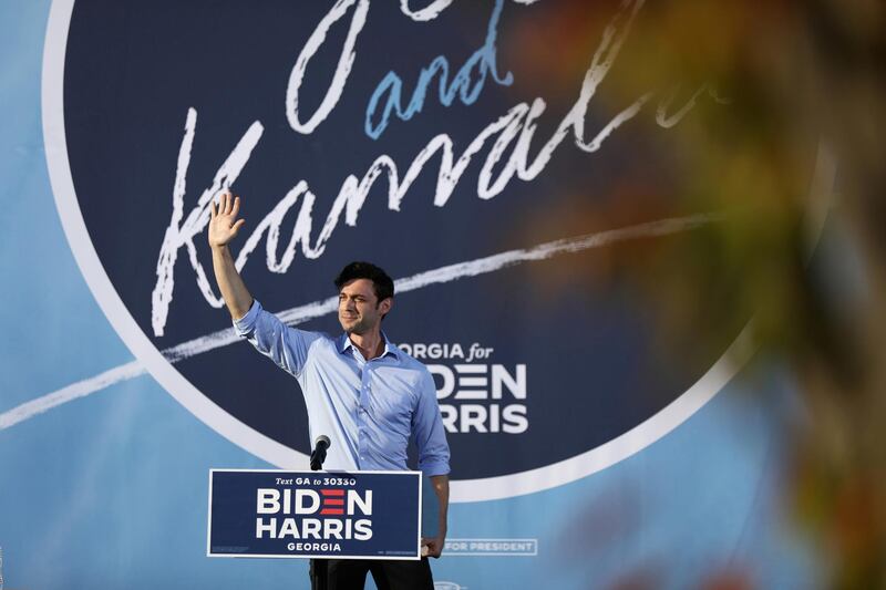 Senate candidate Jon Ossoff waves before U.S. Democratic vice presidential nominee Senator Kamala Harris (D-CA) spoke at a campaign event at Morehouse College in Atlanta, Georgia, U.S. REUTERS