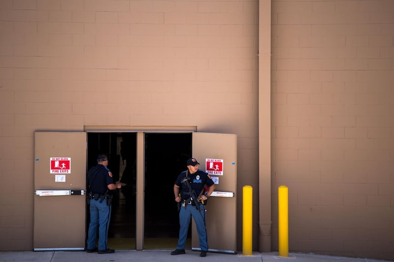 Law enforcement agencies cover the exits of a Walmart where a shooting occurred near Cielo Vista Mall in El Paso, Texas. AFP