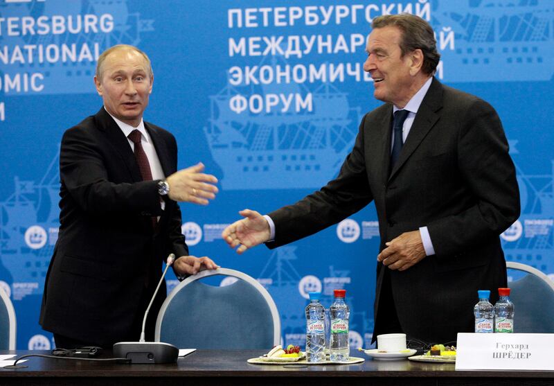 Gerhard Schroeder, right, is a personal friend of Russian President Vladimir Putin. AP