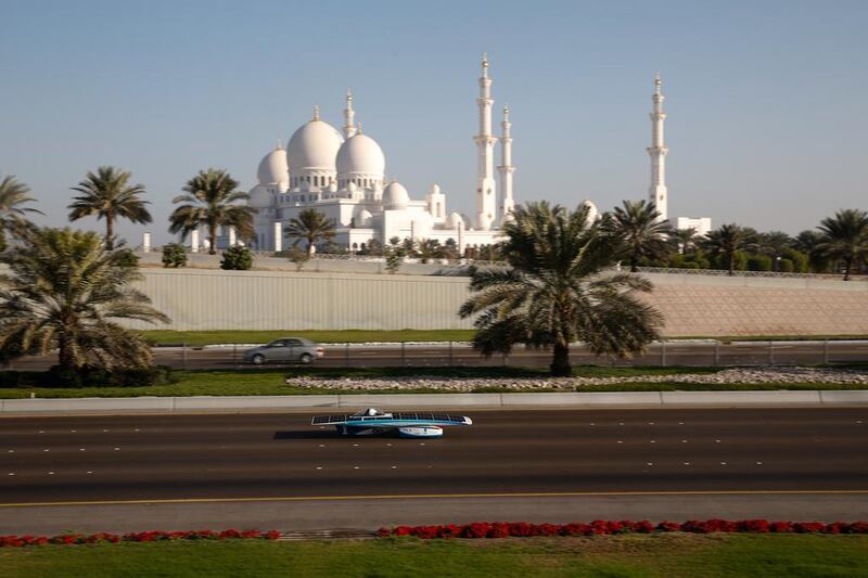 One of the solar-powered cars competing in the Abu Dhabi Solar Challenge passes by Sheikh Zayed Grand Mosque on Friday. Courtesy of Abu Dhabi Solar Challenge



 