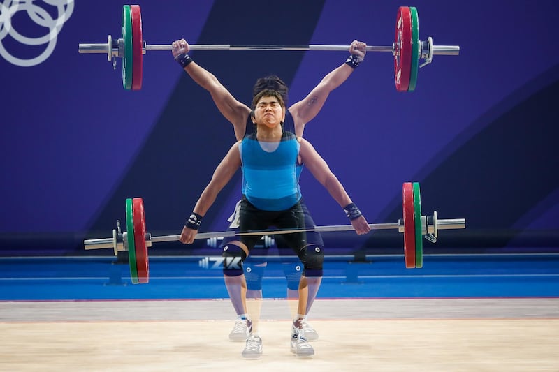 Hidilyn Diaz of the Philippines competing in the 55kg women's snatch competition during the Southeast Asian Games in the Philippines, on Monday, December 2.  EPA