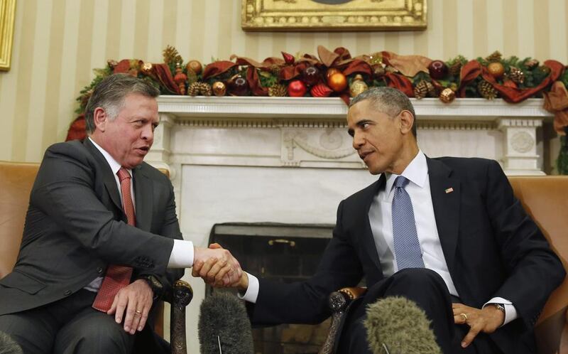 King Abdullah of Jordan and US president Barack Obama shake hands at the Oval Office on December 5, 2014. Larry Downing / Reuters