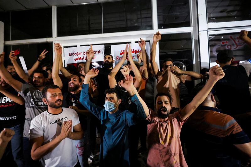Demonstrators gather in front of the Turkish visa application centre in Najaf as they protest against the attack. Reuters