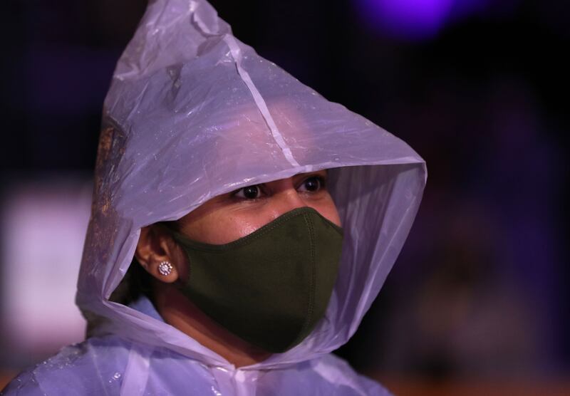 Fans brave the rainy weather to enjoy the K-pop concert. Chris Whiteoak / The National