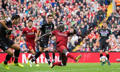 epa06151680 Liverpool’s Sadio Mane (C) scores the opening goal during the English Premier League soccer match between Liverpool and Crystal Palace held at Anfield, Liverpool, Britain, 19 August 2017.  EPA/PETER POWELL EDITORIAL USE ONLY. No use with unauthorized audio, video, data, fixture lists, club/league logos or 'live' services. Online in-match use limited to 75 images, no video emulation. No use in betting, games or single club/league/player publications