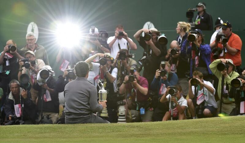 Rory McIlroy poses for photos with the Claret Jug after winning the British Open on Sunday at Royal Liverpool in Hoylake, England. Toby Melville / Reuters