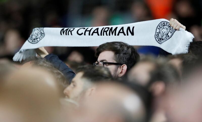Soccer Football - Premier League - Fulham v Leicester City - Craven Cottage, London, Britain - December 5, 2018  Leicester City fan holds a scarf in tribute to the late chairman Vichai Srivaddhanaprabha  REUTERS/David Klein  EDITORIAL USE ONLY. No use with unauthorized audio, video, data, fixture lists, club/league logos or "live" services. Online in-match use limited to 75 images, no video emulation. No use in betting, games or single club/league/player publications.  Please contact your account representative for further details.