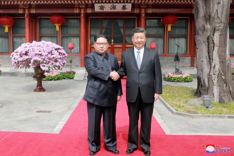 North Korean leader Kim Jong Un shakes hands with Chinese President Xi Jinping, as he paid an unofficial visit to Beijing, China. KCNA / via Reuters