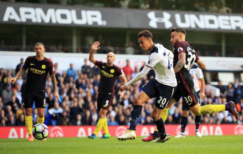 Dele Alli caps off a fine move to score Tottenham's second goal in the 2-0 victory against Manchester City. John Walton / PA