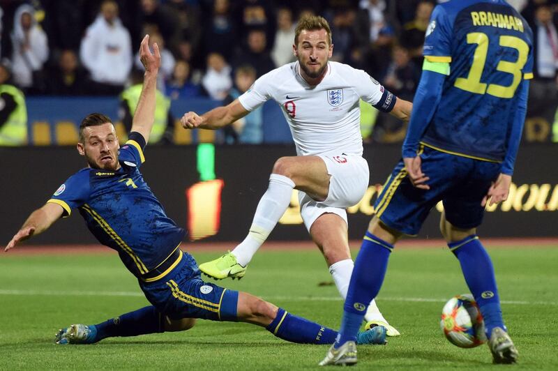 England forward Harry Kane is challenged by Kosovo defender Fidan Aliti. AFP