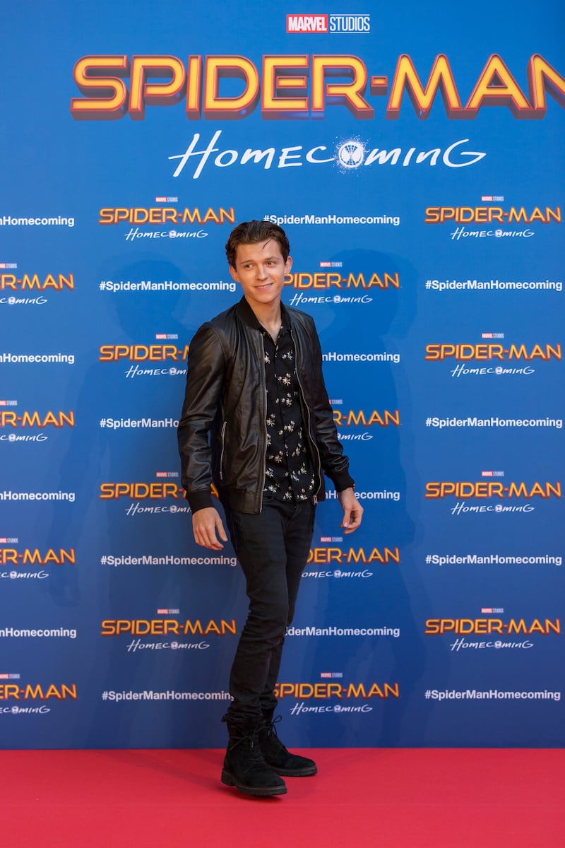 Tom Holland, in a black flower-patterned shirt and leather jacket, attend the 'Spider-Man: Homecoming; premiere in Barcelona on June 18, 2017. Getty Images