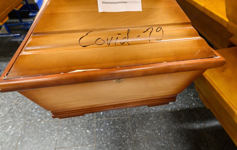 A coffin which contains a person who died with the coronavirus, and is labelled "Covid-19", in a crematorium's cold room in Meissen, Germany. AP Photo