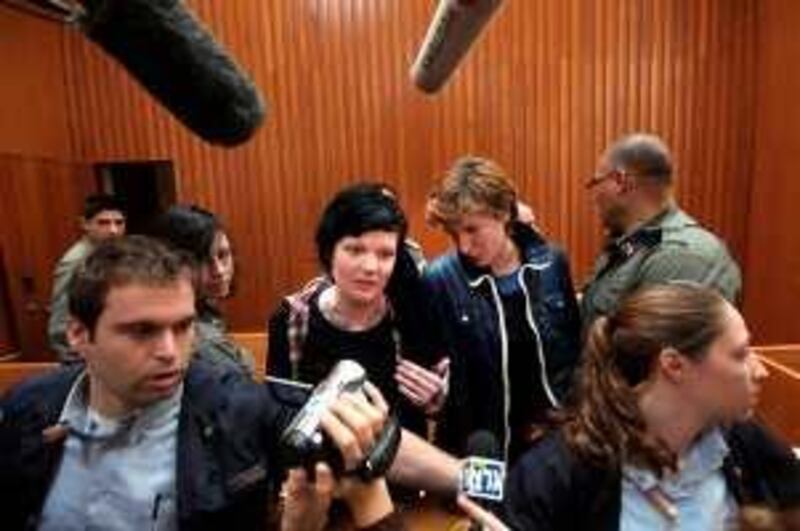 Spaniard Ariadna Jove Marti (C-R) and Australian Bridgette Chappell (C-L) both activists with the "International Solidarity Movement", are seen in Israel's Supreme Court in Jerusalem on February 8, 2010. Israel's Supreme Court ordered the release of the two foreign pro-Palestinian activists seized by the Israeli military in a rare West Bank raid, their lawyer said. The two activists from Spain and Australia were each released on a 25,000 shekel (6,700 dollar, 4,900 euro) bail but banned from entering the occupied Palestinian territories, attorney Omer Shatz told AFP.   AFP PHOTO  ++ ISRAEL OUT++ *** Local Caption ***  804923-01-08.jpg *** Local Caption ***  804923-01-08.jpg