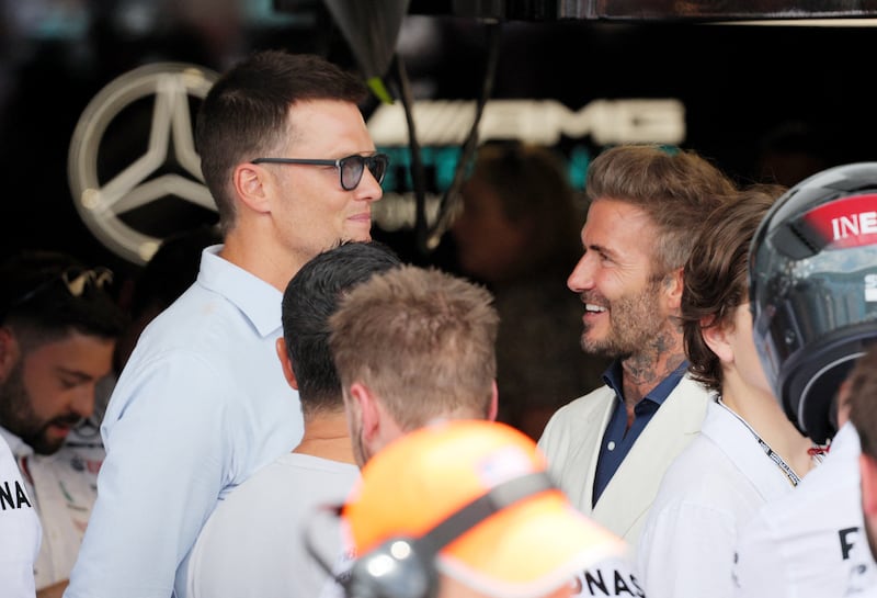 NFL star Tom Brady and David Beckham in conversation before the Miami Grand Prix. Reuters