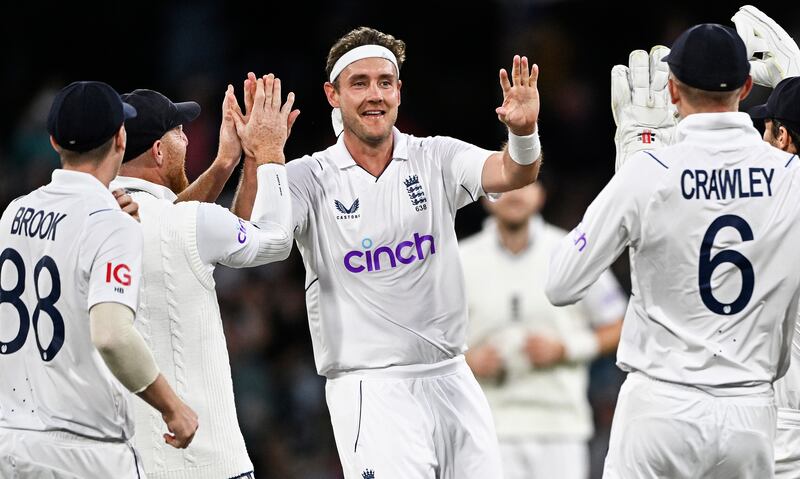 England's Stuart Broad, centre, celebrates with teammates after taking the wicket of New Zealand's Kane Williamson. AP