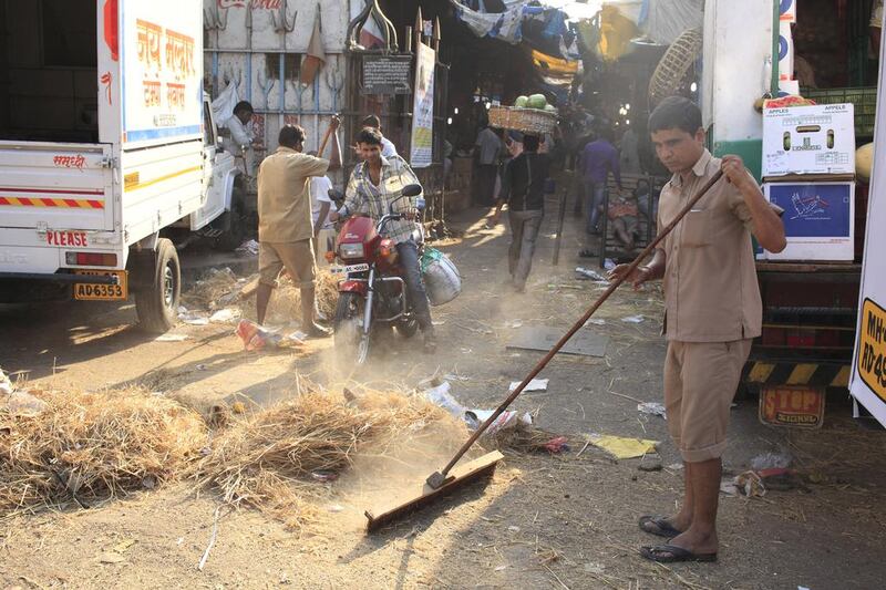 Each morning Mumbai municipal workers do a clean up of Crawford Market. Subhash Sharma for The National