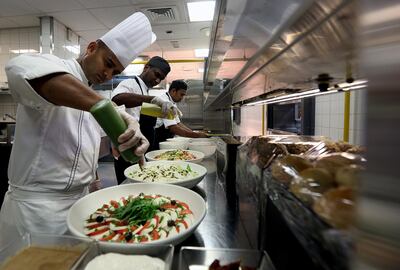 Dubai, July, 10, 2018:  Staff preparing food in the kitchen at the Armani Hotel in Dubai. Satish Kumar for the National/ Story by Patrick Ryan