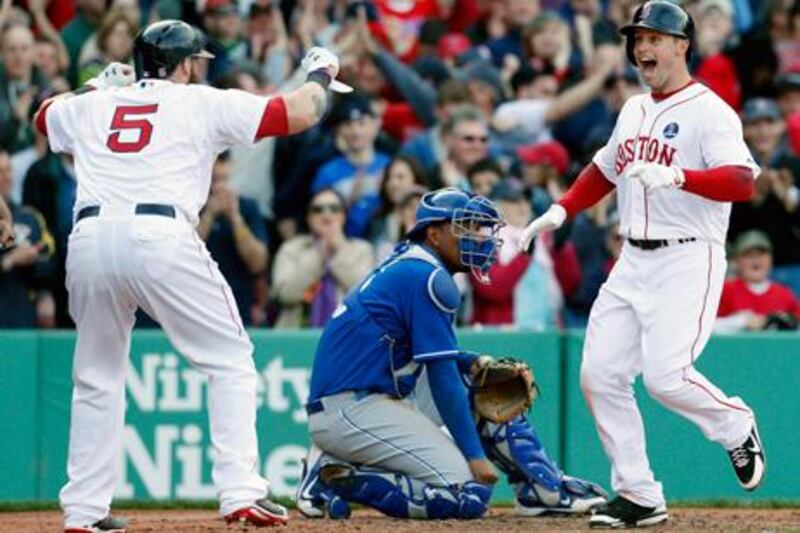 Boston's Daniel Nava celebrates his three-run home run against Kansas City with teammate Jonny Gomes.
