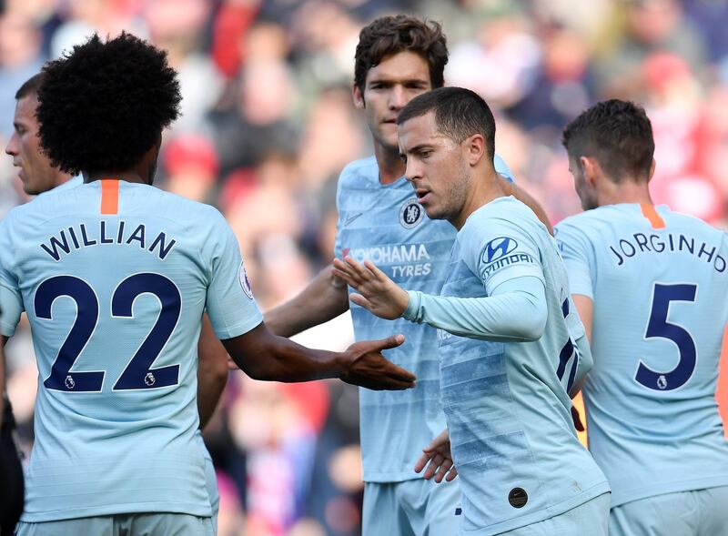 Soccer Football - Premier League - Southampton v Chelsea - St Mary's Stadium, Southampton, Britain - October 7, 2018  Chelsea's Eden Hazard celebrates scoring their first goal with Willian and team mates   REUTERS/Toby Melville  EDITORIAL USE ONLY. No use with unauthorized audio, video, data, fixture lists, club/league logos or "live" services. Online in-match use limited to 75 images, no video emulation. No use in betting, games or single club/league/player publications.  Please contact your account representative for further details.