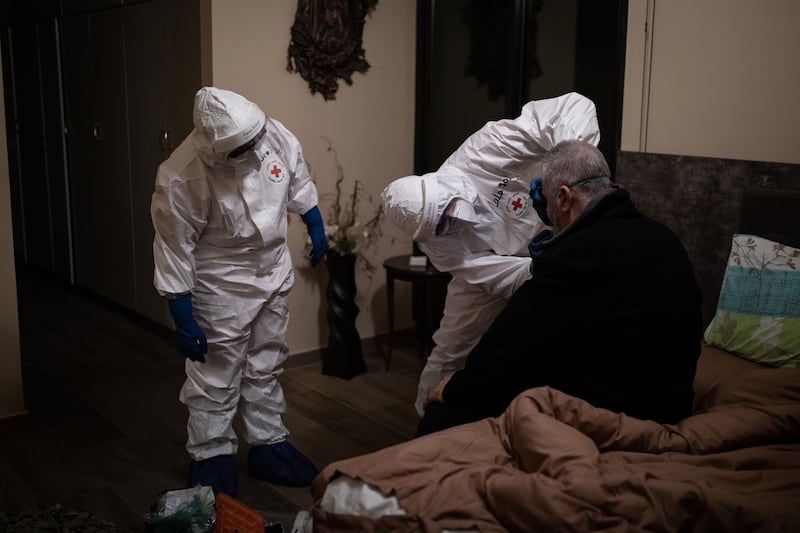 Jounieh, Lebanon. Lebanese Red Cross volunteer paramedics speak to a patient with Coronavirus on a night shift in the Jounieh region. Today Lebanon registered 4176 new Coronavirus cases, and 52 deaths. Tom Nicholson for The National