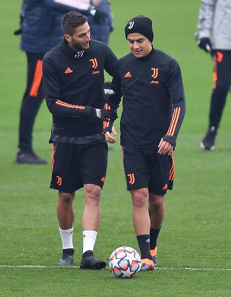 Rodrigo Bentancur, left, and Paulo Dyaba of Juventus during training. EPA