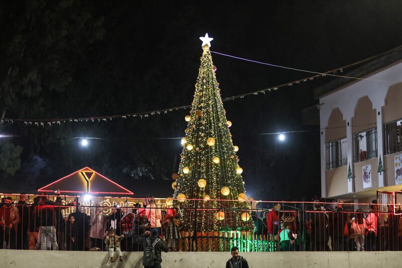 Palestinians light a Christmas tree in Gaza city. Majd Mahmod for The National