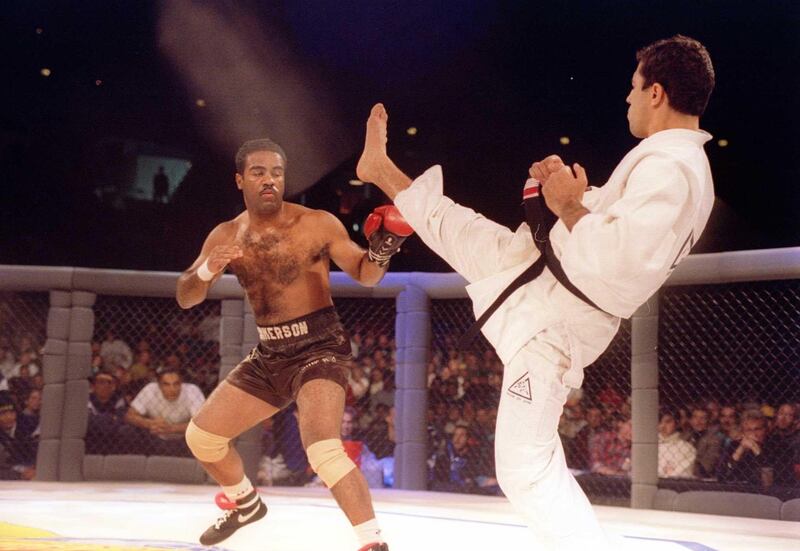 Jiu-Jitsu black belt Royce Gracie kicks at cruiserweight boxer Art Jimmerson during a 1st round match in the Ultimate Fighter Championships in Denver, Colorado. Gracie went on to win the match and eventually the championship. Mandatory Credit: Markus Boes / Getty Images