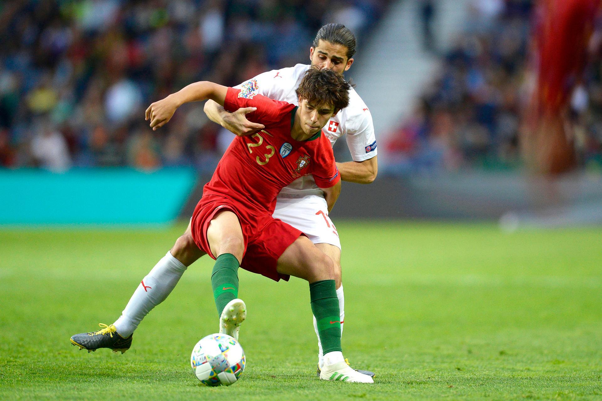 Switzerland's Ricardo Rodriguez (back) in action against Portugal's Joao Felix (front) during the UEFA Nations League semi final.  EPA