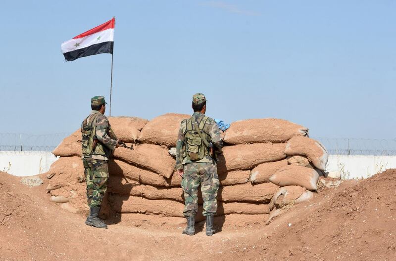 Syrian regime forces man a position in the countryside of the city of Kobane, also known as Ain al-Arab, along the border with Turkey.   AFP