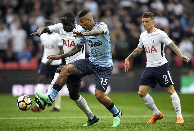 LONDON, ENGLAND - MAY 09: Moussa Sissoko of Tottenham Hotspur is challenged by Kenedy of Newcastle United during the Premier League match between Tottenham Hotspur and Newcastle United at Wembley Stadium on May 9, 2018 in London, England.  (Photo by Stu Forster/Getty Images)