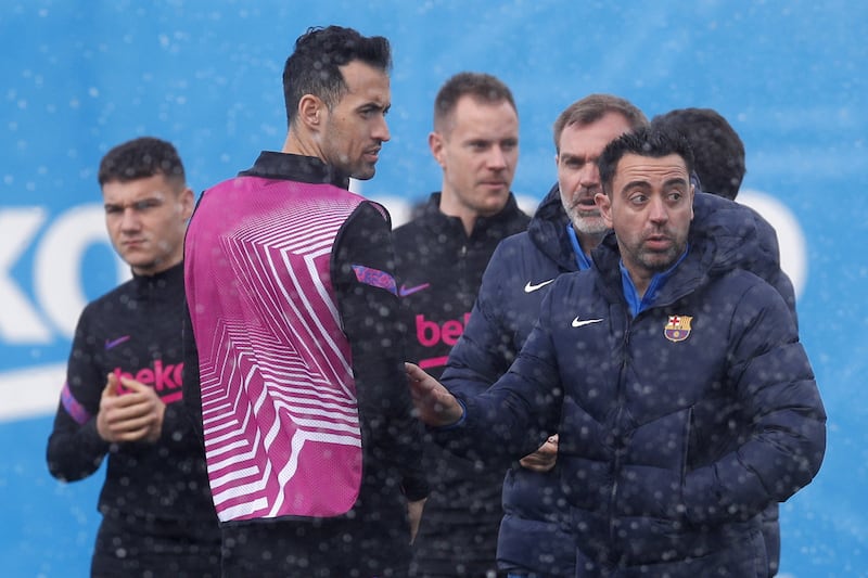 Barcelona manager Xavi Hernandez and Sergio Busquets during training. EPA