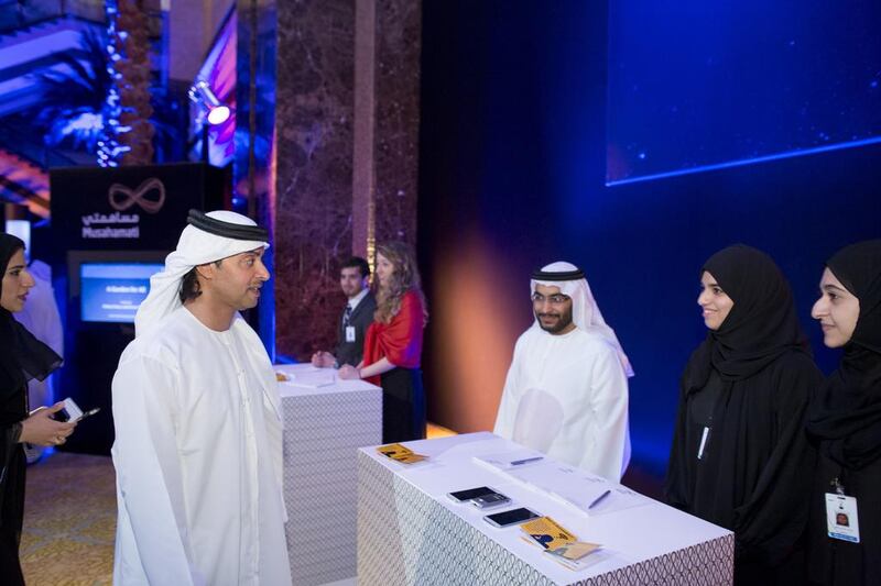 Sheikh Hazza bin Zayed, speaks with Musahamati runners-up, Maha Ahmed Al Mufti, Amira Hamed Al Ameri, and Hamdan Abdulla Al Sheikaili, for their project entitled Diabetes Real-time Mobile System, during the award ceremony. Ryan Carter / Crown Prince Court — Abu Dhabi