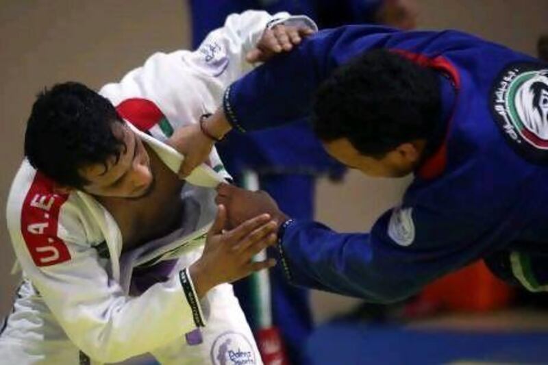 Mohamed Al Zaabi, left, and Mohamed Al Qubaisi, grapple in training. Al Qubaisi says his UAE teammates are his ‘brothers’ and that jiu-jitsu has ‘made him a better person’. Al Zaabi carries medal hopes at blue belt, while Al Qubaisi is a contender for a gold medal in purple belt.