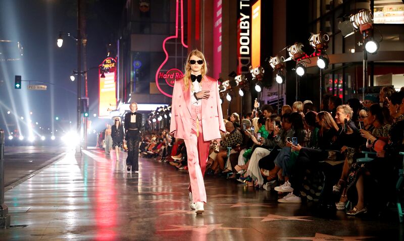 Some models wore chunky silver platform shoes, patent leather flats and white pointy boots. Reuters