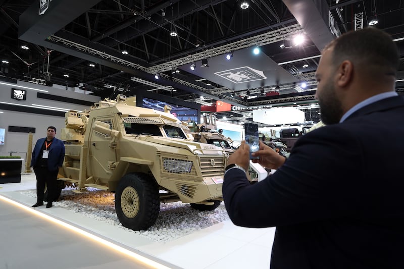 Visitors view a Titan - GT Artillery platform at the Inkas armoured vehicles stand