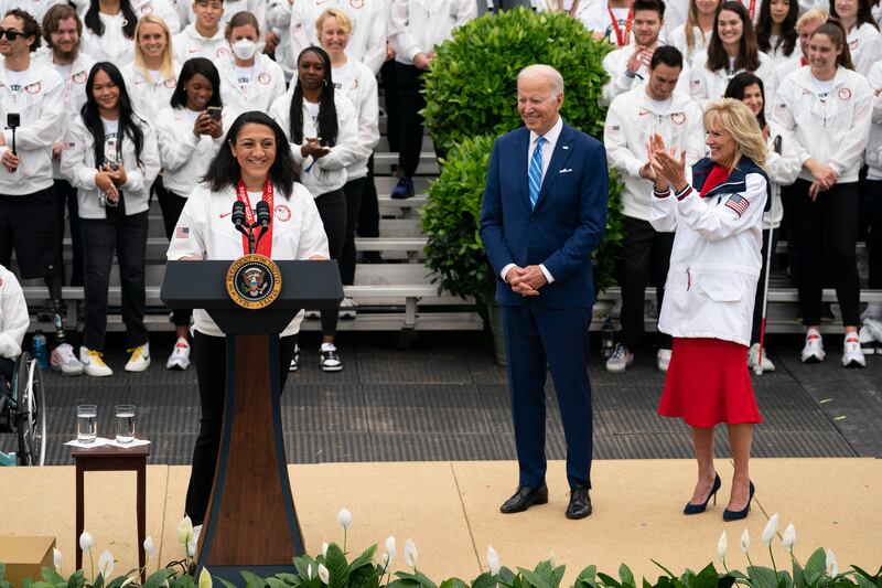 US President Joe Biden and first lady Jill Biden listen as bobsledder Elana Meyers Taylor speaks. AP