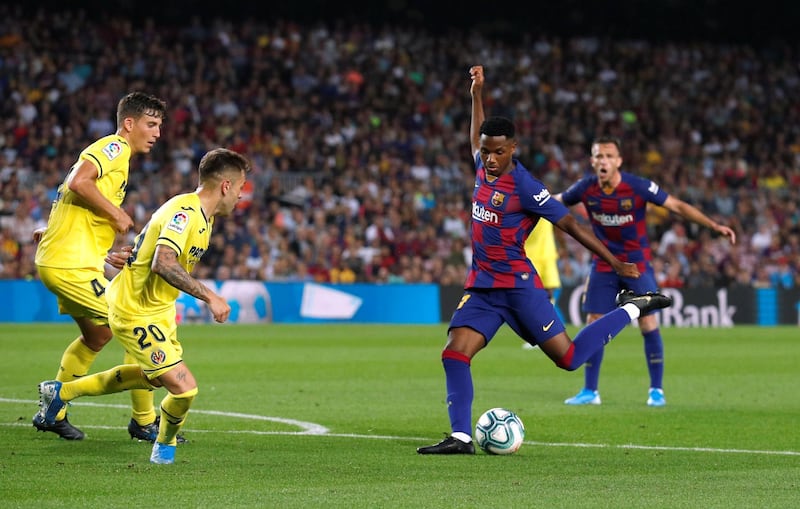 Barcelona's Ansu Fati in action with Villarreal's Ruben Pena. Reuters