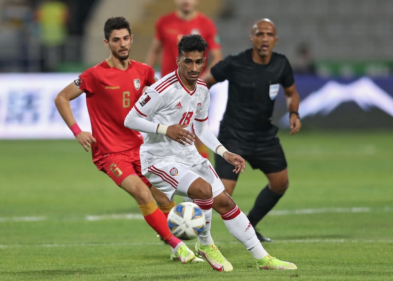 UAE midfielder Abdullah Ramadan is put under pressure by Syria midfielder Kamel Hmeisheh during the 2022 World Cup qualifier in Jordan. AFP