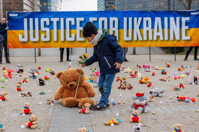 Teddy bears and toys are placed in front of the European Commission to represent the abduction of thousands of Ukrainian children by Russia. AP