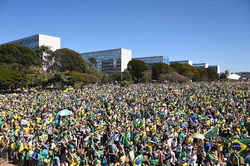 People take part in a rally in support of Brazilian President Jair Bolsonaro in the capital Brasilia.