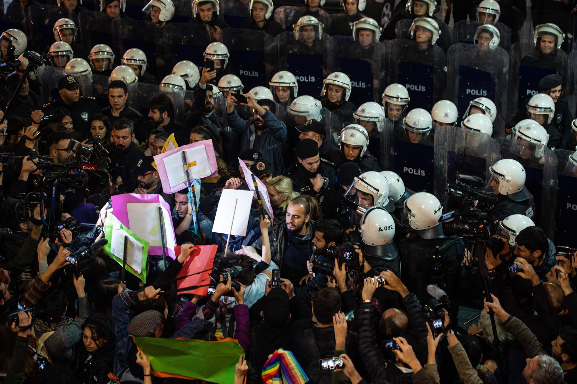 Demonstrators scuffle with riot police. Getty Images