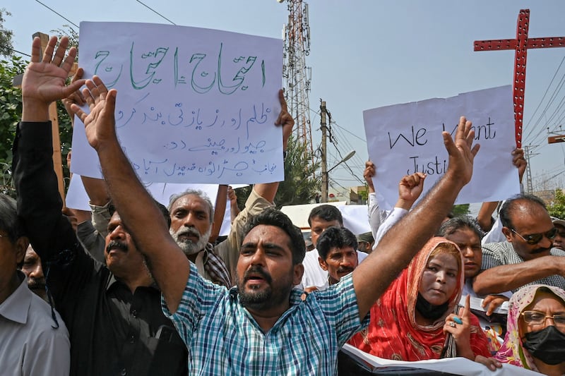 Christians shout slogans during a protest in Peshawar to condemn the attacks. AFP