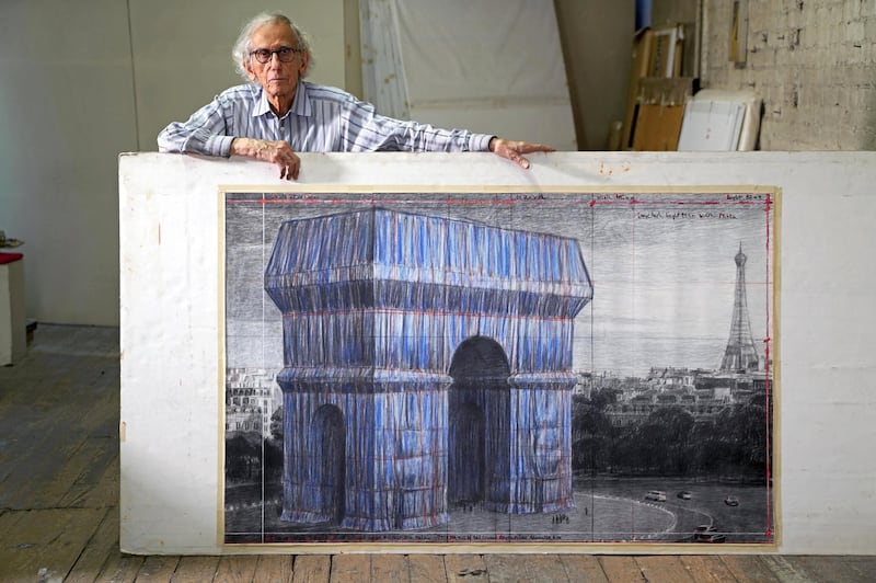 Christo in his studio in 2019 with a preparatory drawing for 'L'Arc de Triomphe, Wrapped'. Estate of Christo V Javacheff