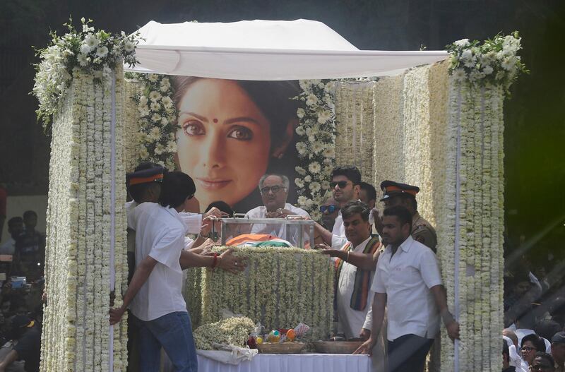 The body of Indian actress Sridevi is carried on a lorry during her funeral in Mumbai, India. Thousands of grieving fans gathered to pay respects to the actress who drowned accidentally in a Dubai hotel bathtub. Rafiq Maqbool / AP Photo