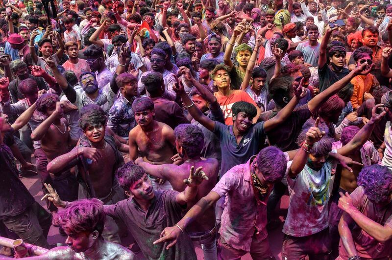 Revellers celebrate Holi, the Festival of Colours, in Guwahati, India. AFP