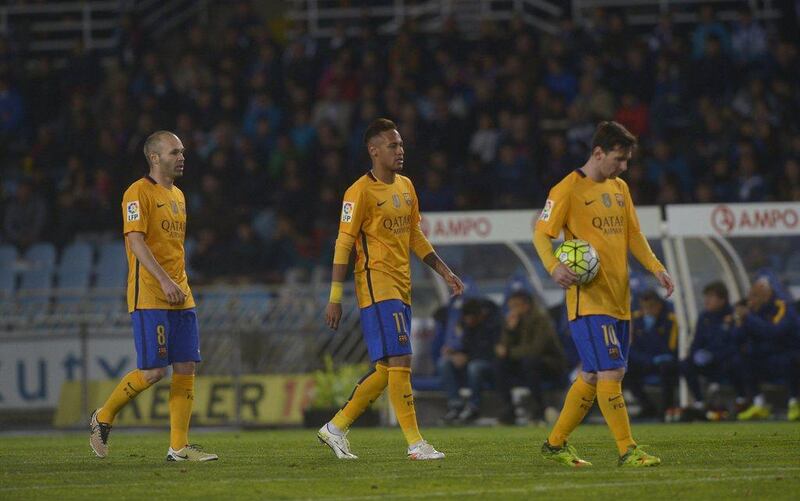 Barcelona’s Andres Iniesta, Neymar and Lionel Messi react during their loss on Saturday to Real Sociedad in La Liga. Vincent West / Reuters / April 9, 2016 