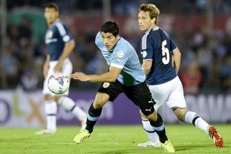 Luis Suarez, left, during Uruguay's 3-2 win over Argentina on Tuesday night. Buda Mendes / Getty Images