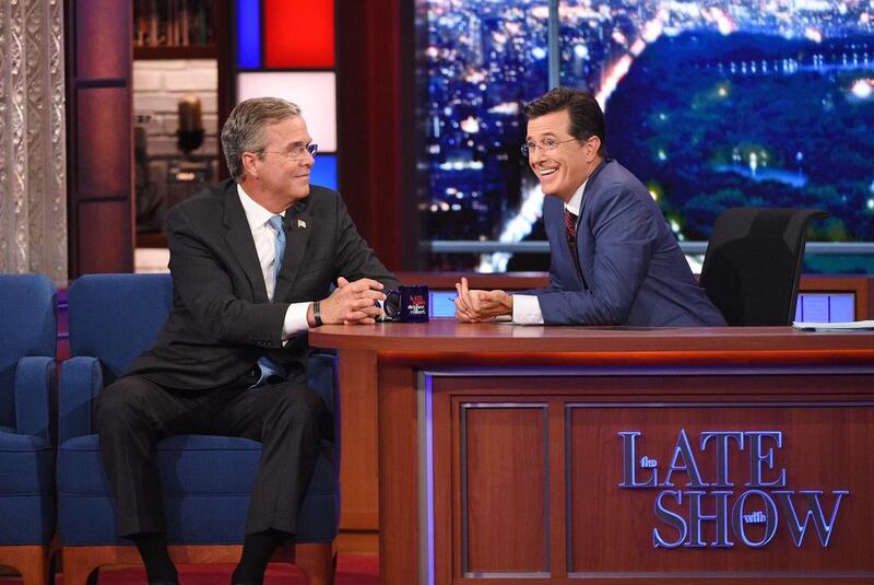 Stephen Colbert, right, talks with Republican presidential candidate Jeb Bush in 2015 debut show. Jeffrey R. Staab / CBS via AP